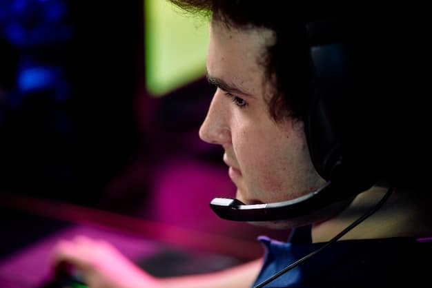 A close-up shot of a professional esports PC gamer during a tournament, showing intense focus on their face and hands rapidly maneuvering the keyboard and mouse. The background is blurred with the audience and stage lights.