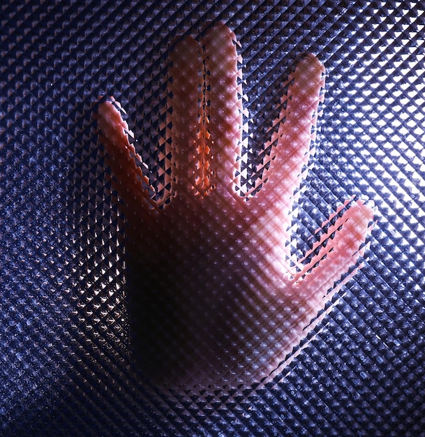 A close-up of a haptic glove, showing the intricate network of sensors and actuators that provide tactile feedback. The image emphasizes the precision and complexity of the technology.