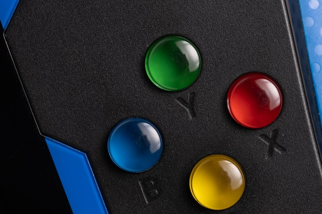 A close-up shot of an adaptive gaming controller, showcasing various customizable buttons, joysticks, and switches designed to accommodate different hand sizes and motor abilities. The controller is connected to a gaming console.