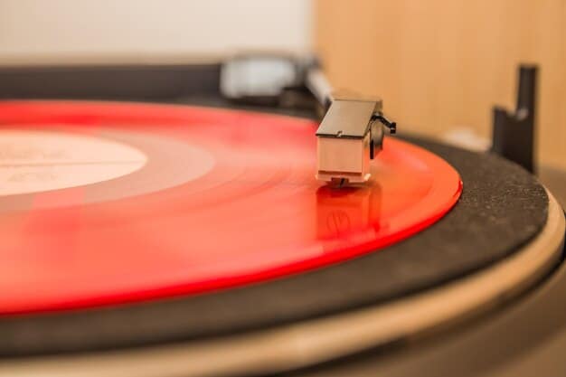 A close-up of a vinyl record spinning on a turntable, with a neon sign in the background displaying 