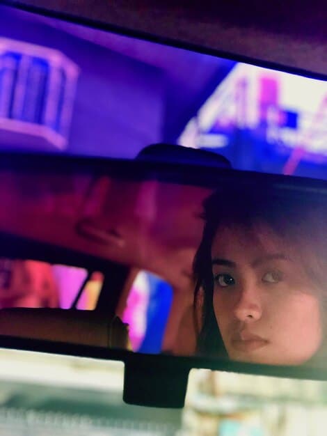 A split-screen image highlighting potential social media references in the GTA 6 trailer. On one side, show a character filming with a phone, mimicking a TikTok video. On the other side, a crowd reacting to an event, reminiscent of a viral moment. The image should illustrate how GTA 6 integrates modern social trends into its gameplay.