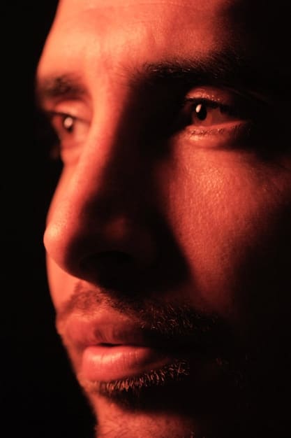 A close-up shot of Lucia's face, highlighting her intense gaze and expressions. The lighting is dramatic, emphasizing the shadows and contours of her face to convey depth and emotion.